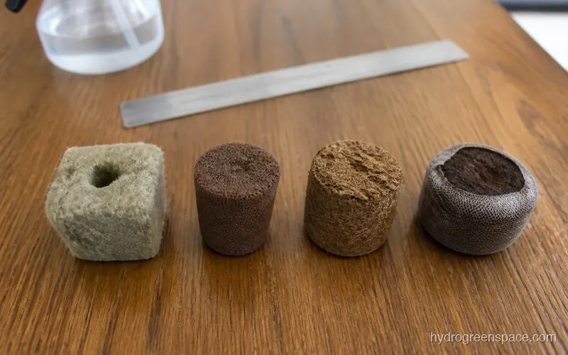 Four different propagation media side by side: rockwool cube, rapid rooter plug, coco coir plug, and expanded peat pellet showing size and texture differences